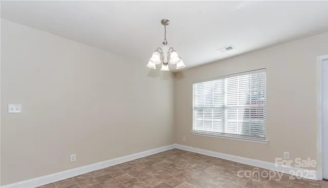 a view of a windows and chandelier in a room