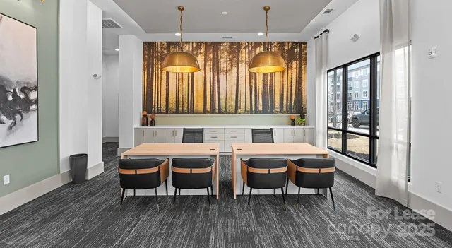 a view of a a dining room with furniture window and wooden floor