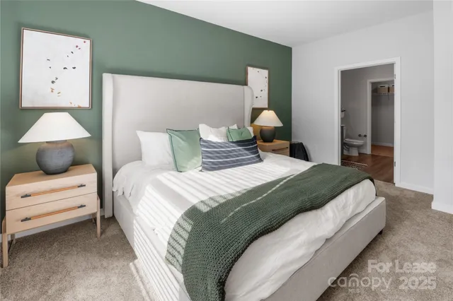 a bedroom with a bed and a lamp