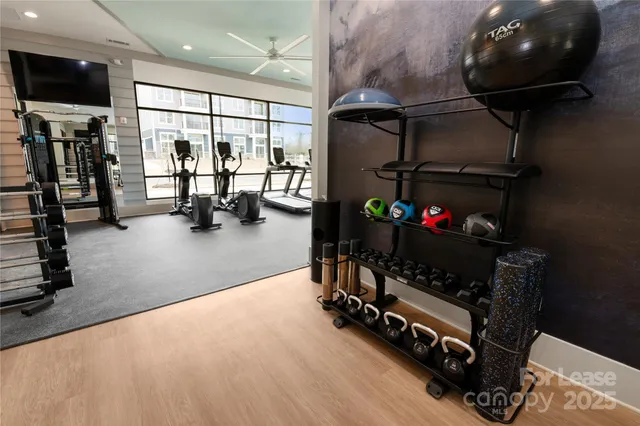 a room with gym equipment and a large window
