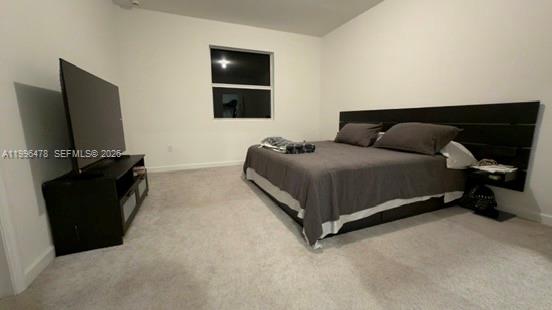 17854 Southwest 359 Terrace Homestead, FL 33034 - Photo 19 of 46 a living room with a bed furniture and a flat screen tv