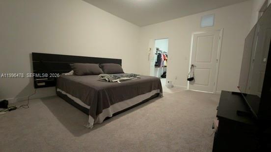 17854 Southwest 359 Terrace Homestead, FL 33034 - Photo 20 of 46 a bedroom with a bed and a flat tv screen on a dresser