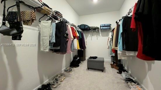 17854 Southwest 359 Terrace Homestead, FL 33034 - Photo 21 of 46 a view of walk in closet with clothes and shoes