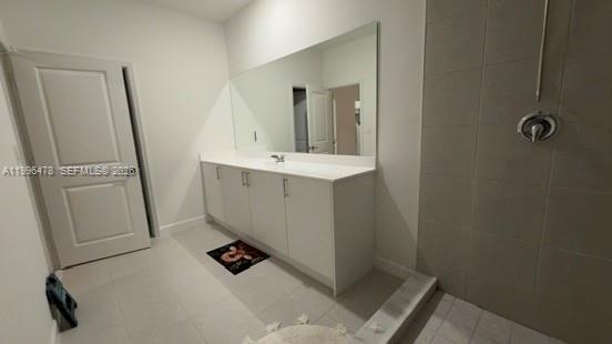 17854 Southwest 359 Terrace Homestead, FL 33034 - Photo 24 of 46 a bathroom with a sink a mirror and shower