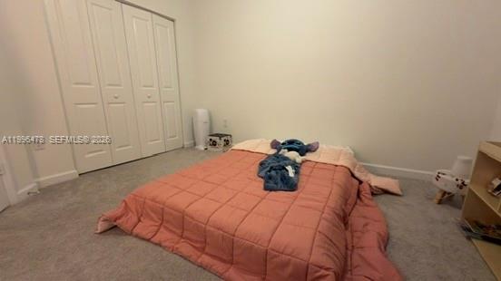 17854 Southwest 359 Terrace Homestead, FL 33034 - Photo 29 of 46 a bedroom with a bed and a table