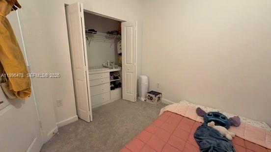 17854 Southwest 359 Terrace Homestead, FL 33034 - Photo 30 of 46 a view of walk in closet with clothes and shoes