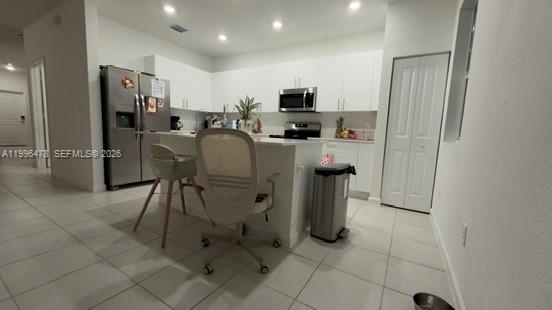 17854 Southwest 359 Terrace Homestead, FL 33034 - Photo 4 of 46 a kitchen with stainless steel appliances a refrigerator and a stove top oven