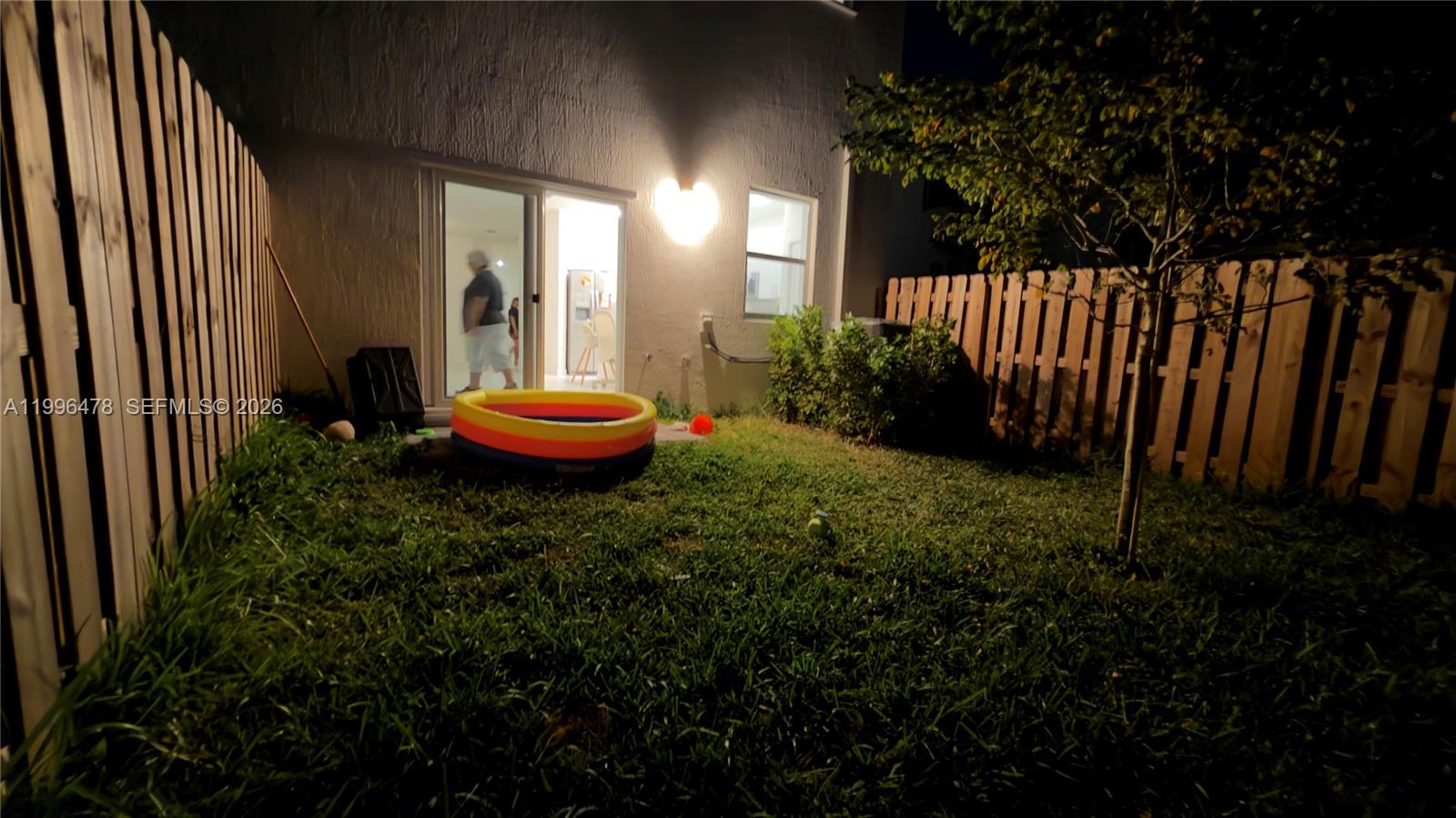 17854 Southwest 359 Terrace Homestead, FL 33034 - Photo 46 of 46 a backyard of a house with a table and chairs