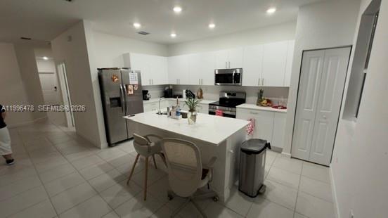 17854 Southwest 359 Terrace Homestead, FL 33034 - Photo 5 of 46 a kitchen with stainless steel appliances a refrigerator sink and microwave