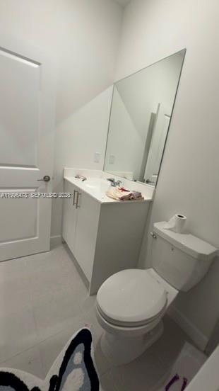 17854 Southwest 359 Terrace Homestead, FL 33034 - Photo 10 of 46 a white toilet sitting next to a bathroom sink and vanity