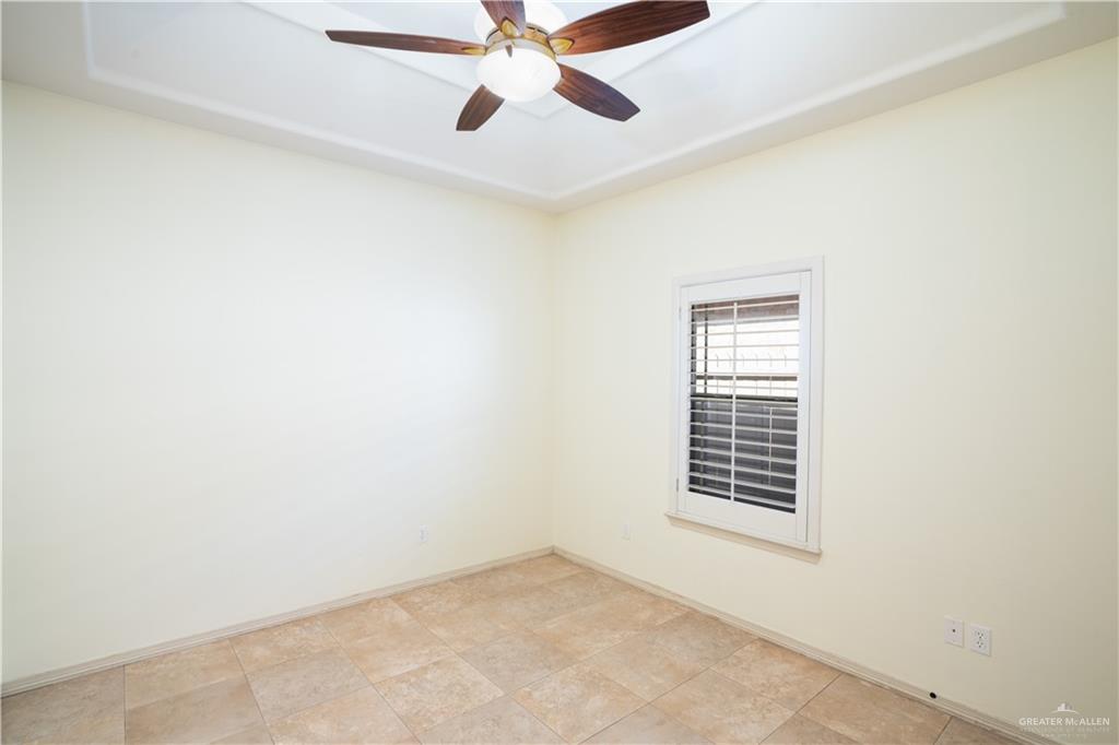 3305 Santa Monica Street Mission, TX 78572 - Photo 16 of 28 an empty room with windows and fan