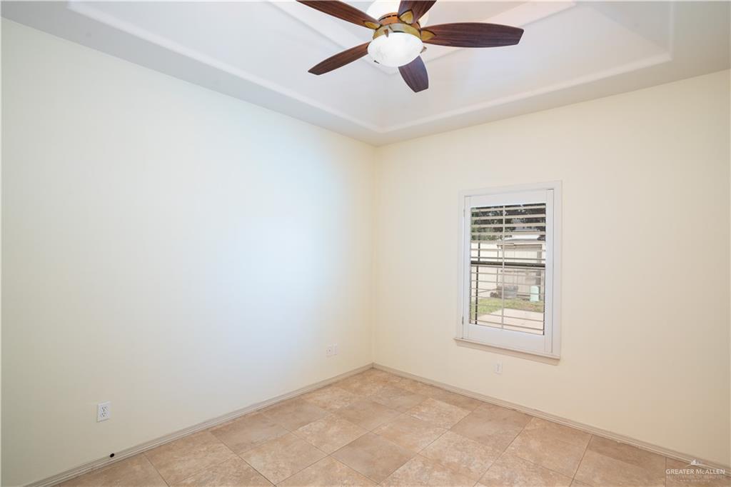 3305 Santa Monica Street Mission, TX 78572 - Photo 18 of 28 an empty room with windows and fan