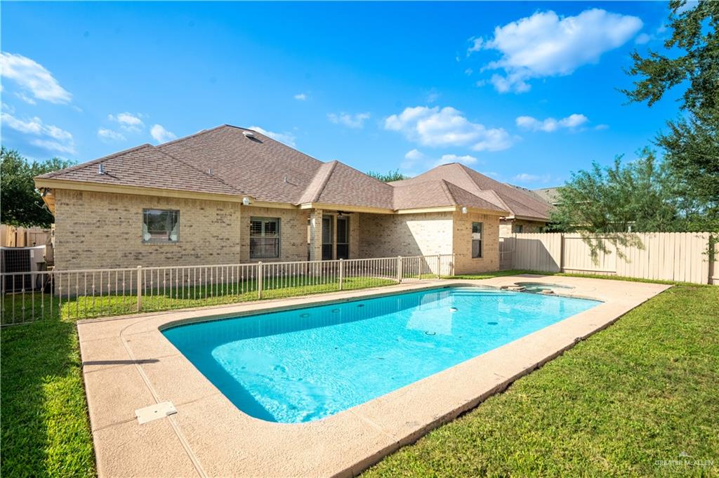 3305 Santa Monica Street Mission, TX 78572 - Photo 23 of 28 a view of a house with pool and a yard