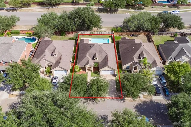 an aerial view of residential house with outdoor space and lake view