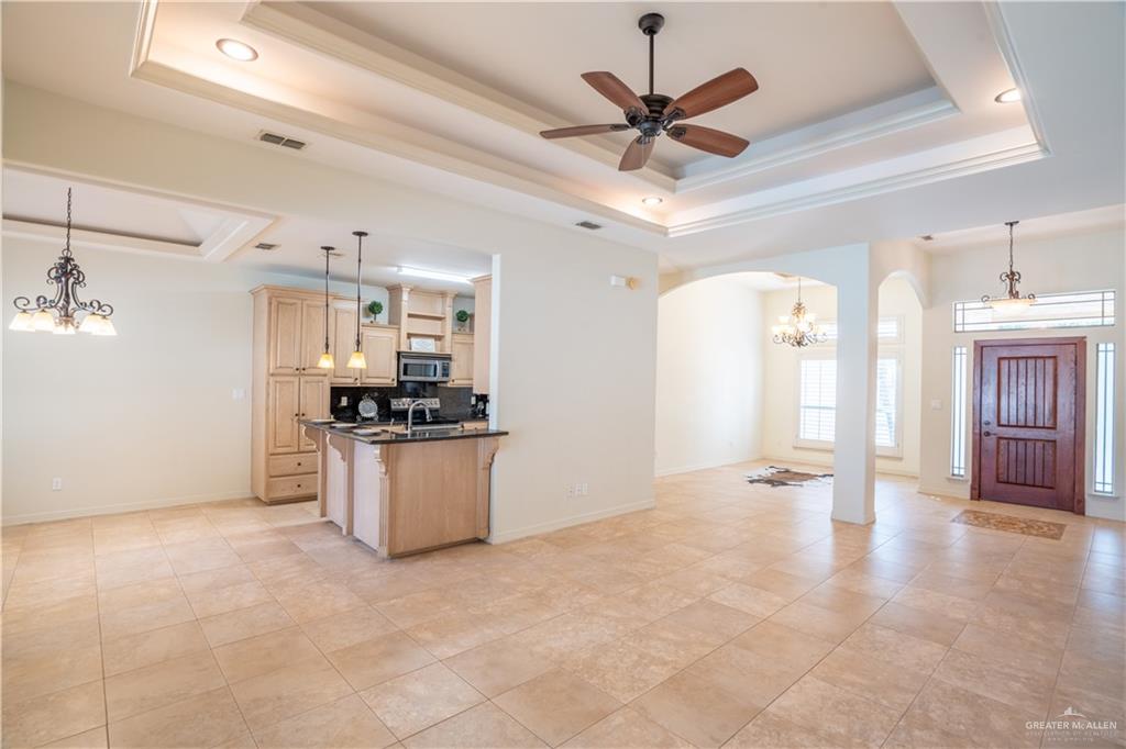 3305 Santa Monica Street Mission, TX 78572 - Photo 5 of 28 a view of a kitchen with a sink and a stove top oven