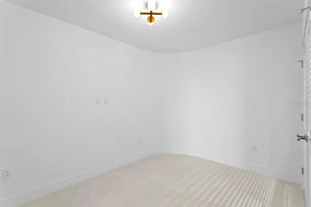 a bathroom with a granite countertop toilet a sink and a mirror