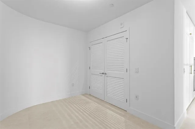 a view of a terrace with furniture and a garden