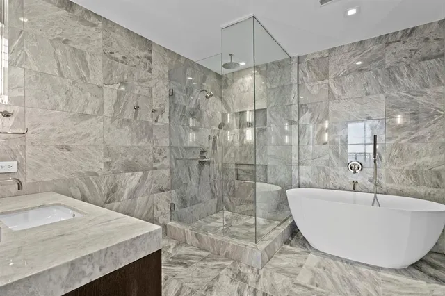 a view of a kitchen with a sink and a refrigerator