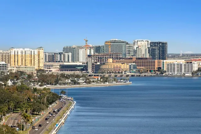 a kitchen with stainless steel appliances granite countertop a sink and a granite counter tops