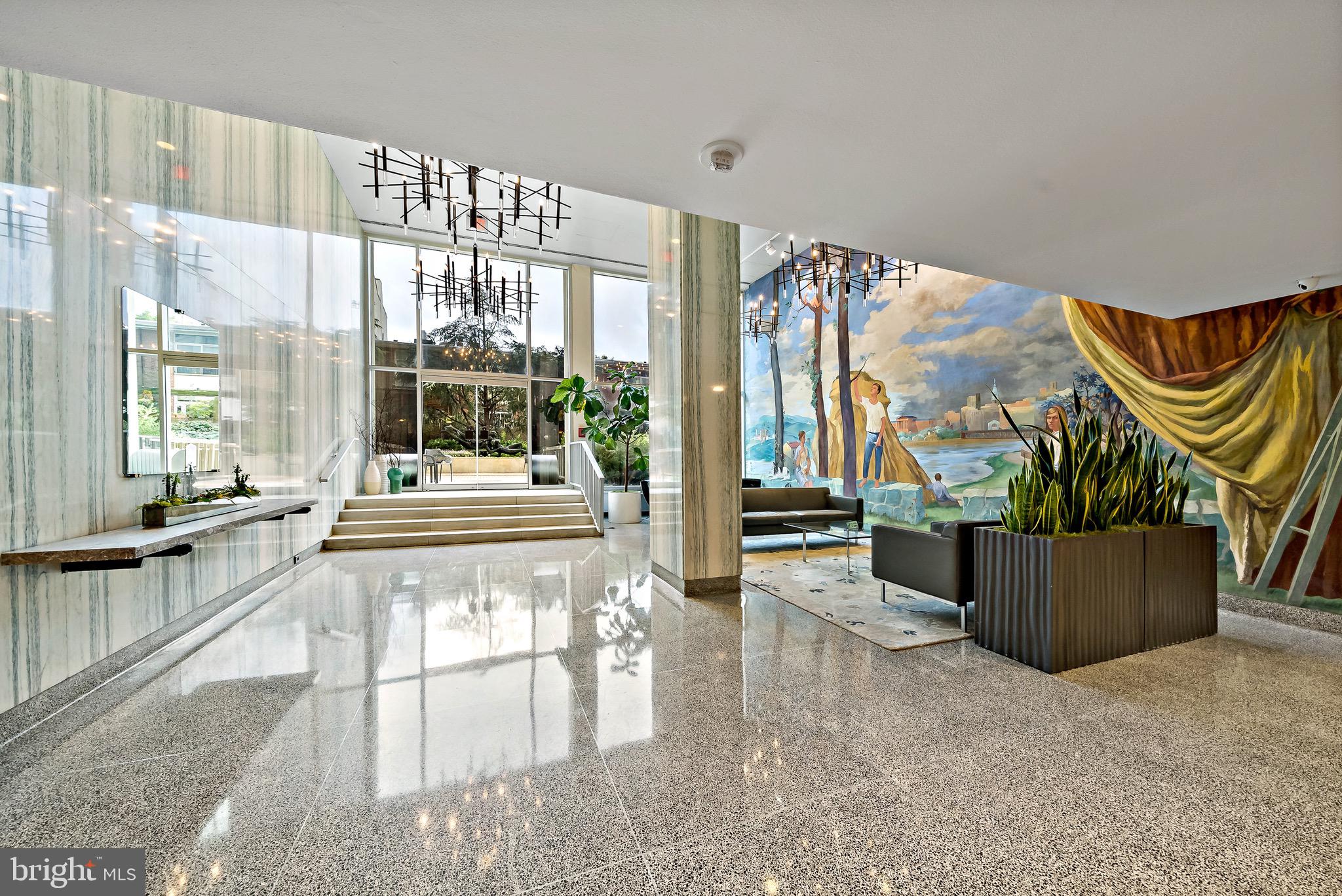 604 South Washington Square, Unit 1015 Philadelphia, PA 19106 - Photo 16 of 24 a living room with furniture and a floor to ceiling window