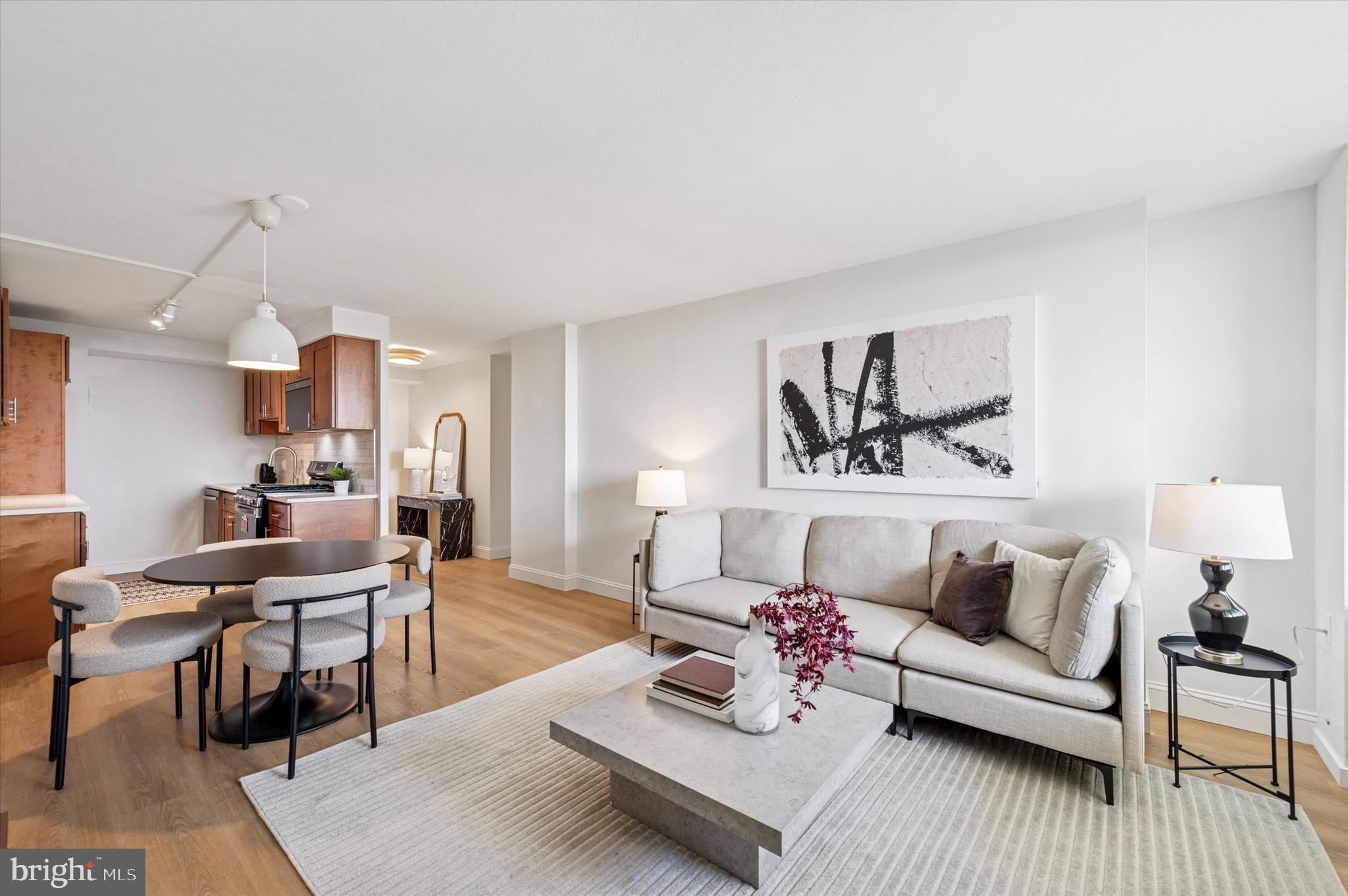 604 South Washington Square, Unit 1015 Philadelphia, PA 19106 - Photo 2 of 24 a living room with furniture and wooden floor
