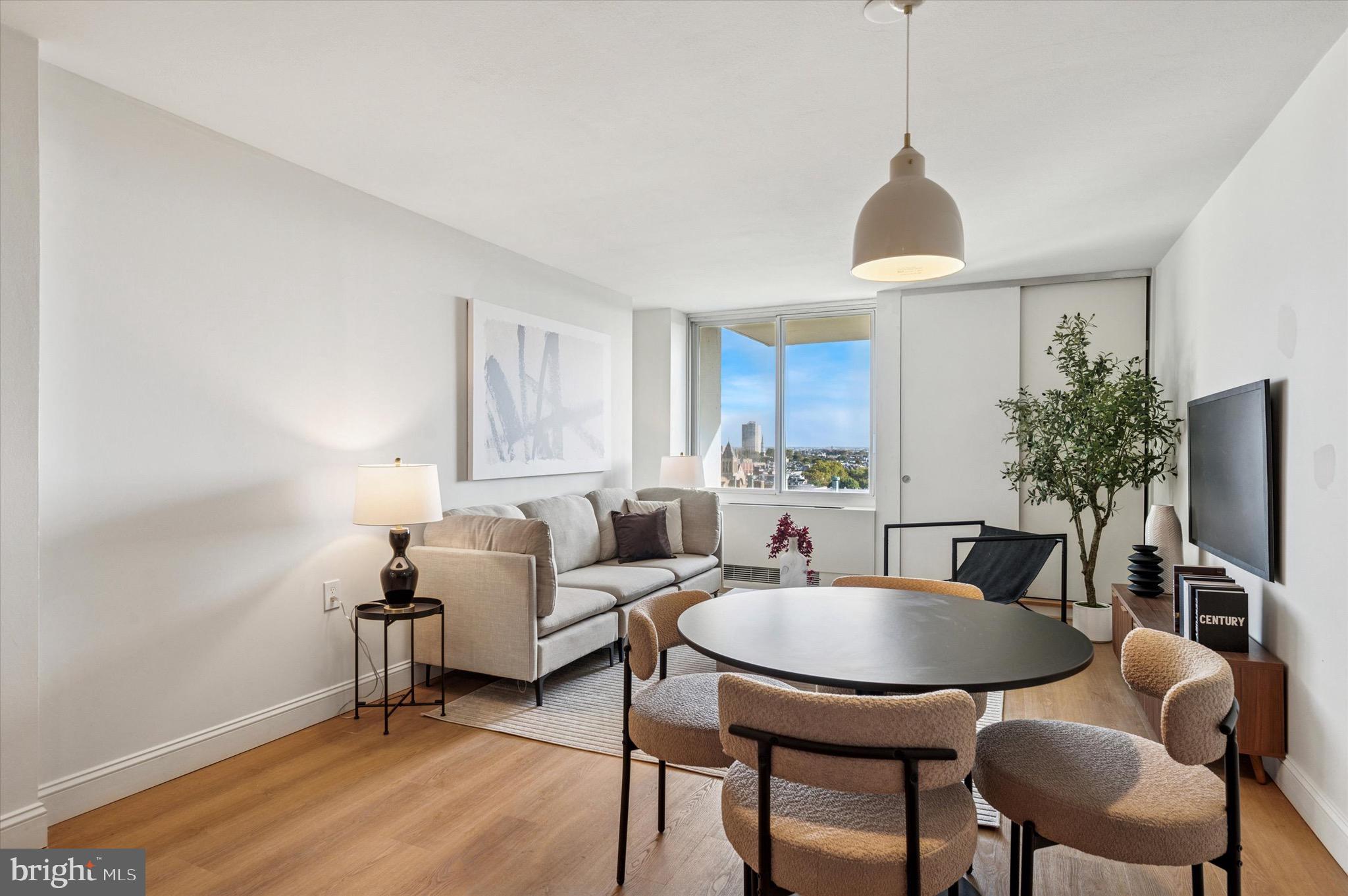 604 South Washington Square, Unit 1015 Philadelphia, PA 19106 - Photo 5 of 24 a view of a livingroom with furniture and a table