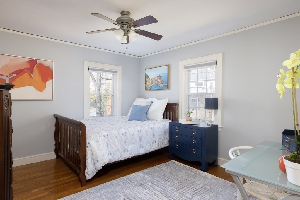 274 Beverly Road Brookline, MA 02467 - Photo 11 of 18 a bedroom with a bed and wooden floor