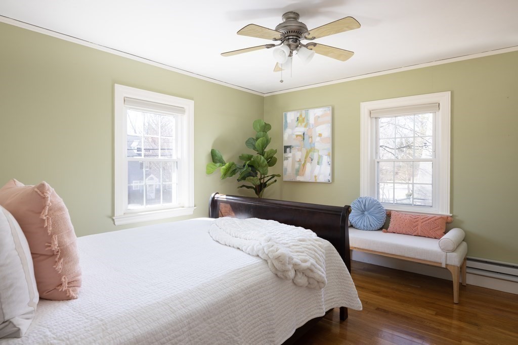 274 Beverly Road Brookline, MA 02467 - Photo 12 of 18 a spacious bedroom with a bed a couch and a window