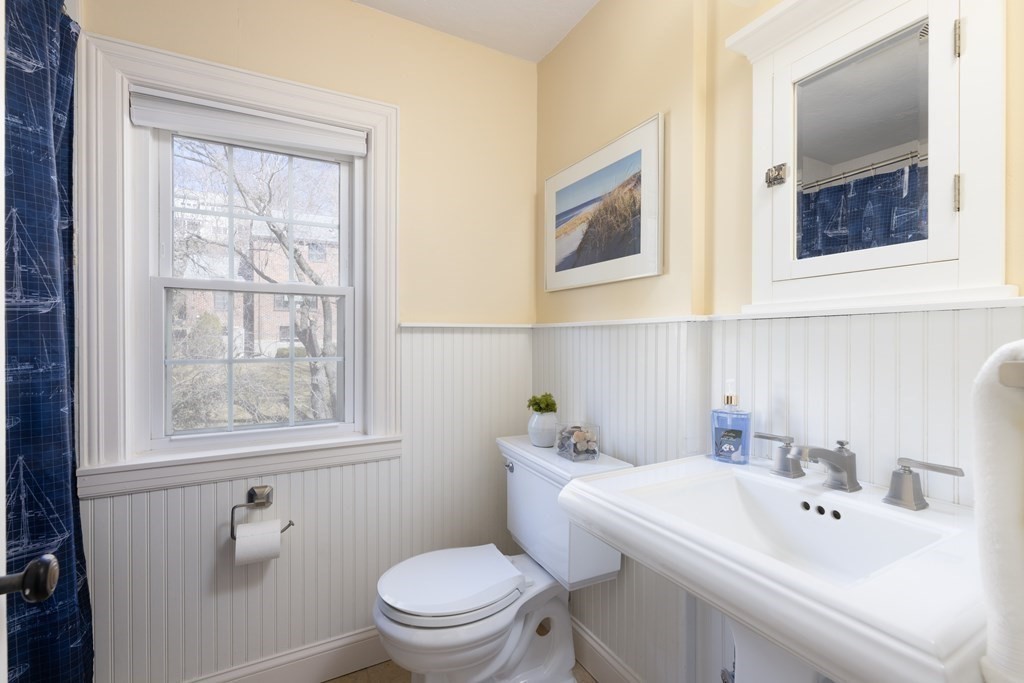 274 Beverly Road Brookline, MA 02467 - Photo 14 of 18 a bathroom with a sink a toilet and a window