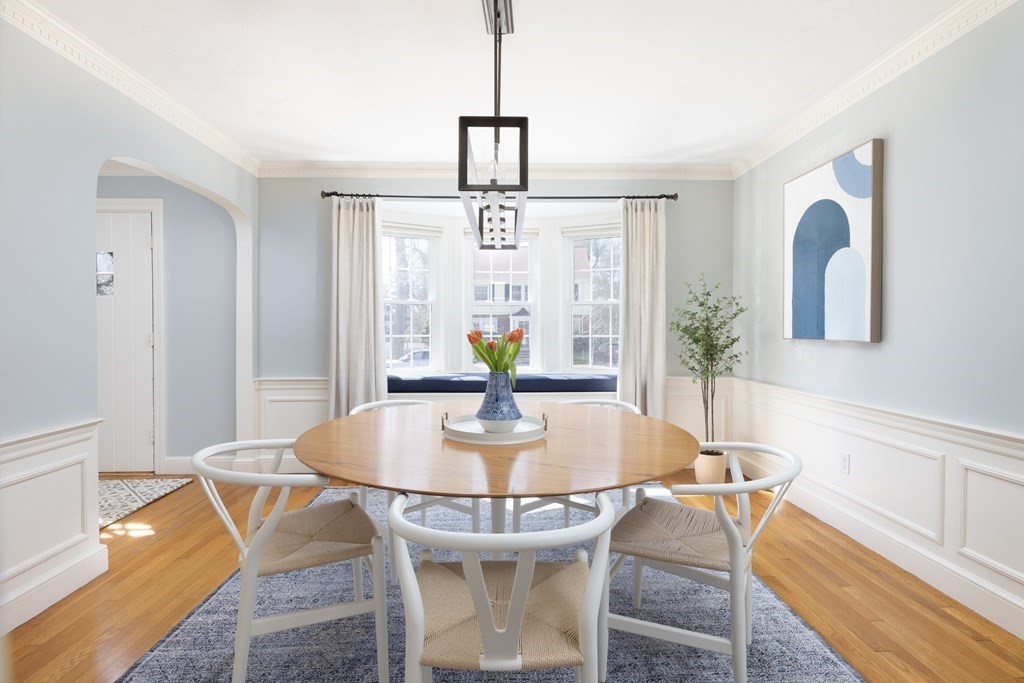 274 Beverly Road Brookline, MA 02467 - Photo 3 of 18 a dining room with chandelier and wooden floor