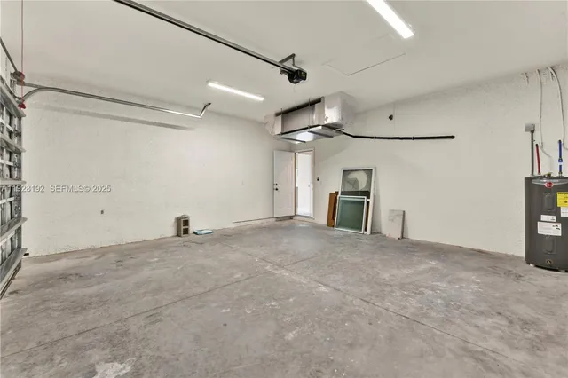 a view of a livingroom with a fireplace and a ceiling fan