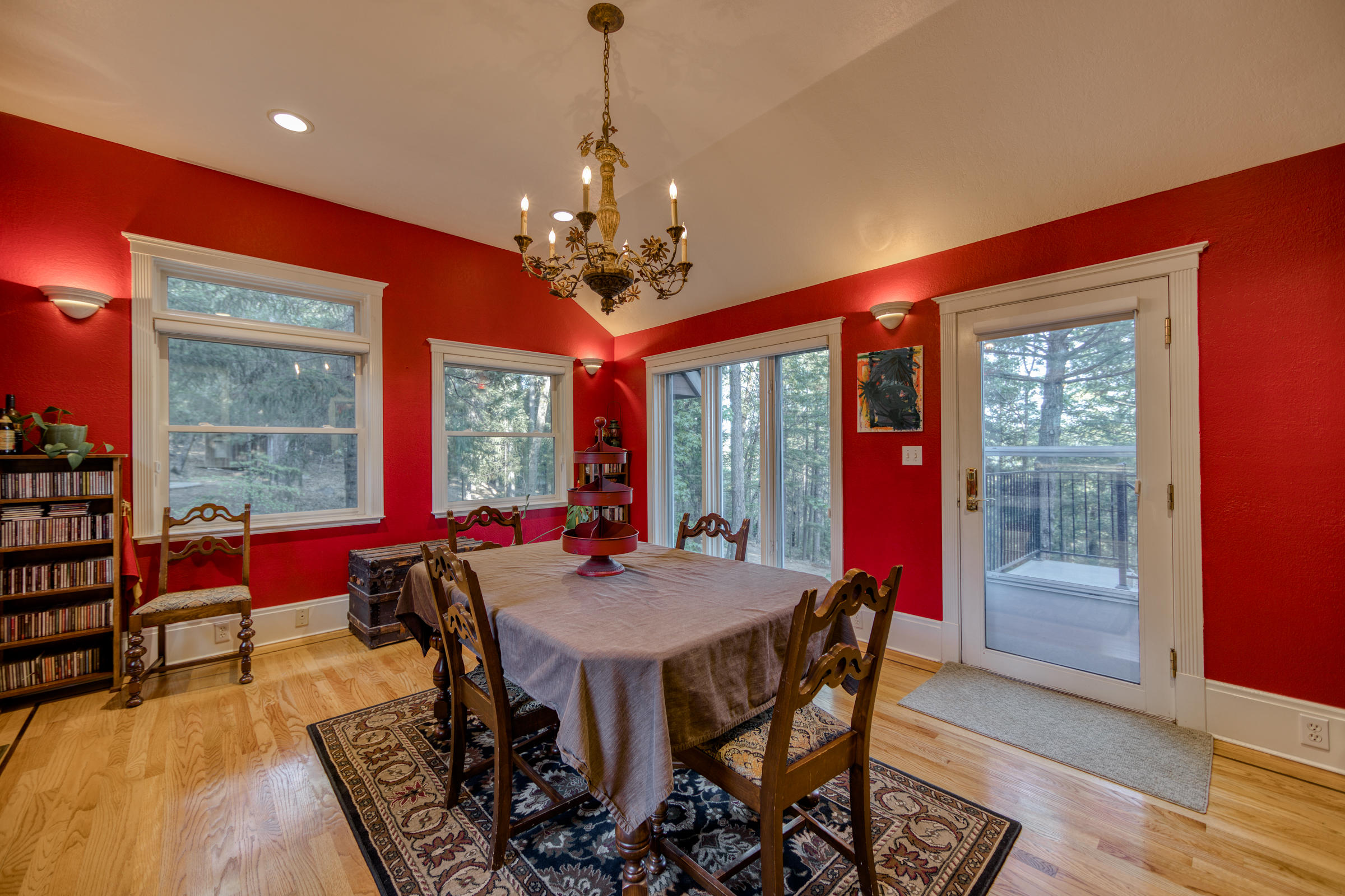 29581 Oak Run To Fern Road Oak Run, CA 96069 - Photo 54 of 133 a view of a dining room with furniture wooden floor and a chandelier