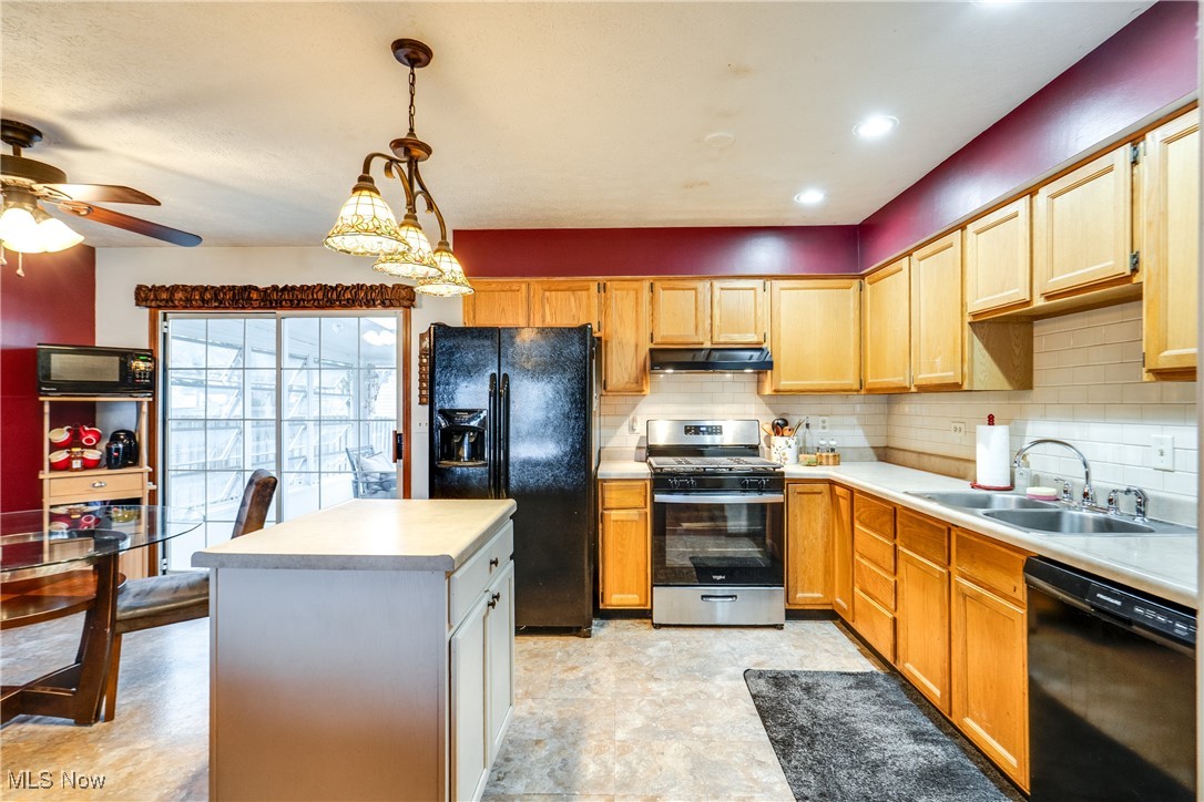 5844 Ridgeview Boulevard North Ridgeville, OH 44039 - Photo 14 of 28 Kitchen with black appliances, backsplash, light countertops, and recessed lighting