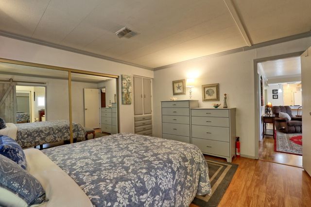 a bed room with a bed and a dresser