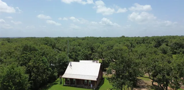 an aerial view of a house with a garden