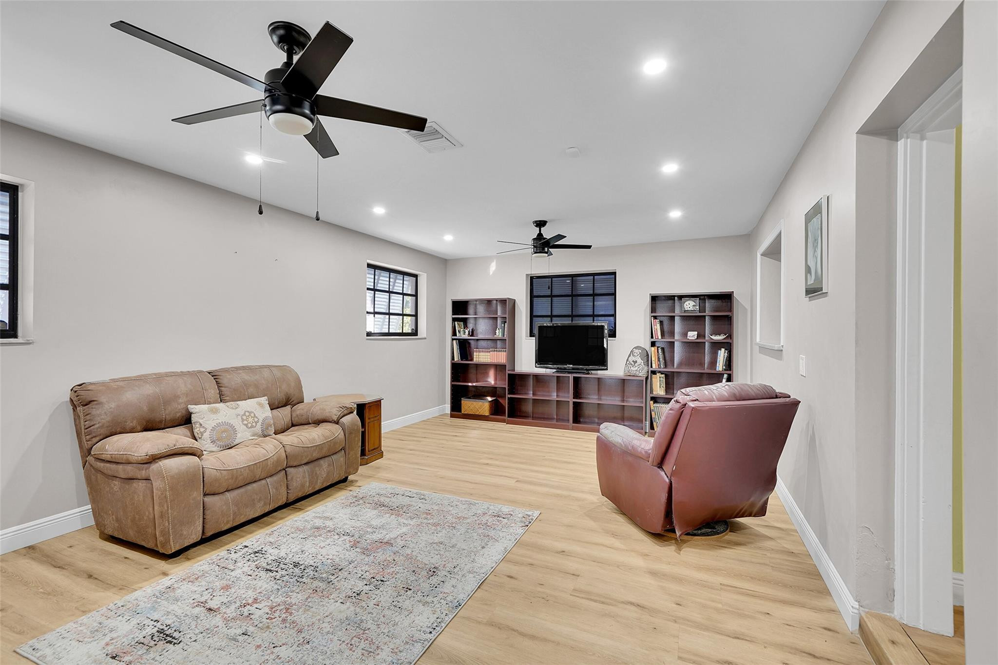 238 Southeast 3rd Street Dania Beach, FL 33004 - Photo 16 of 34 a living room with furniture and a flat screen tv