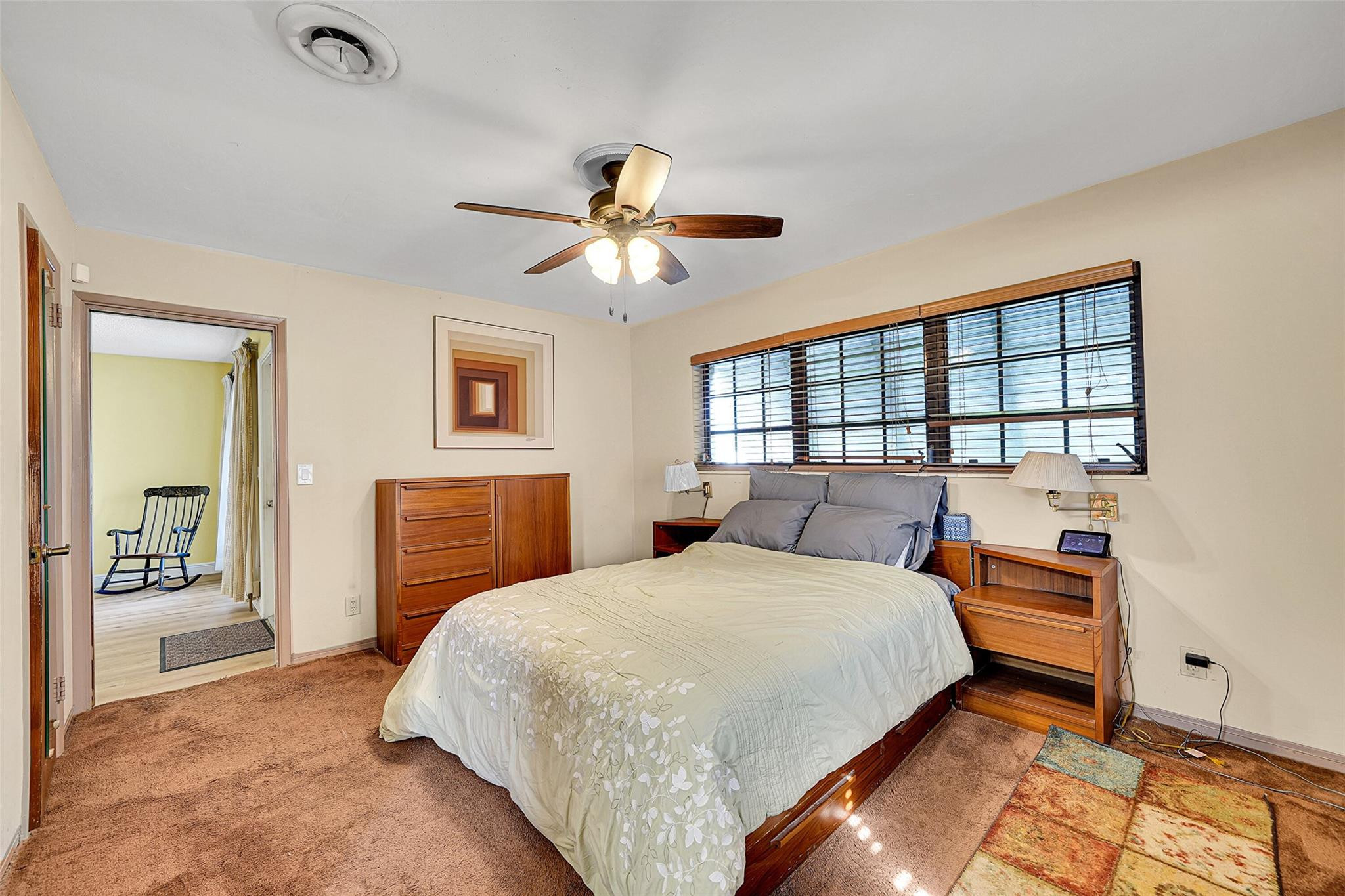238 Southeast 3rd Street Dania Beach, FL 33004 - Photo 17 of 34 a bedroom with a bed and a chandelier