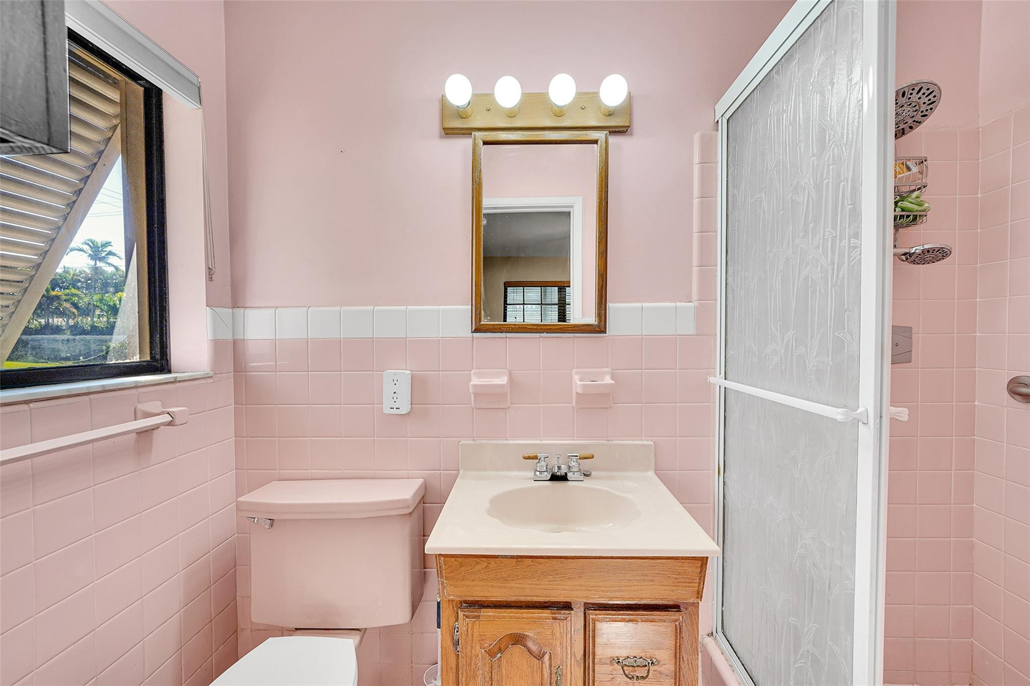 238 Southeast 3rd Street Dania Beach, FL 33004 - Photo 19 of 34 a bathroom with a sink toilet and mirror