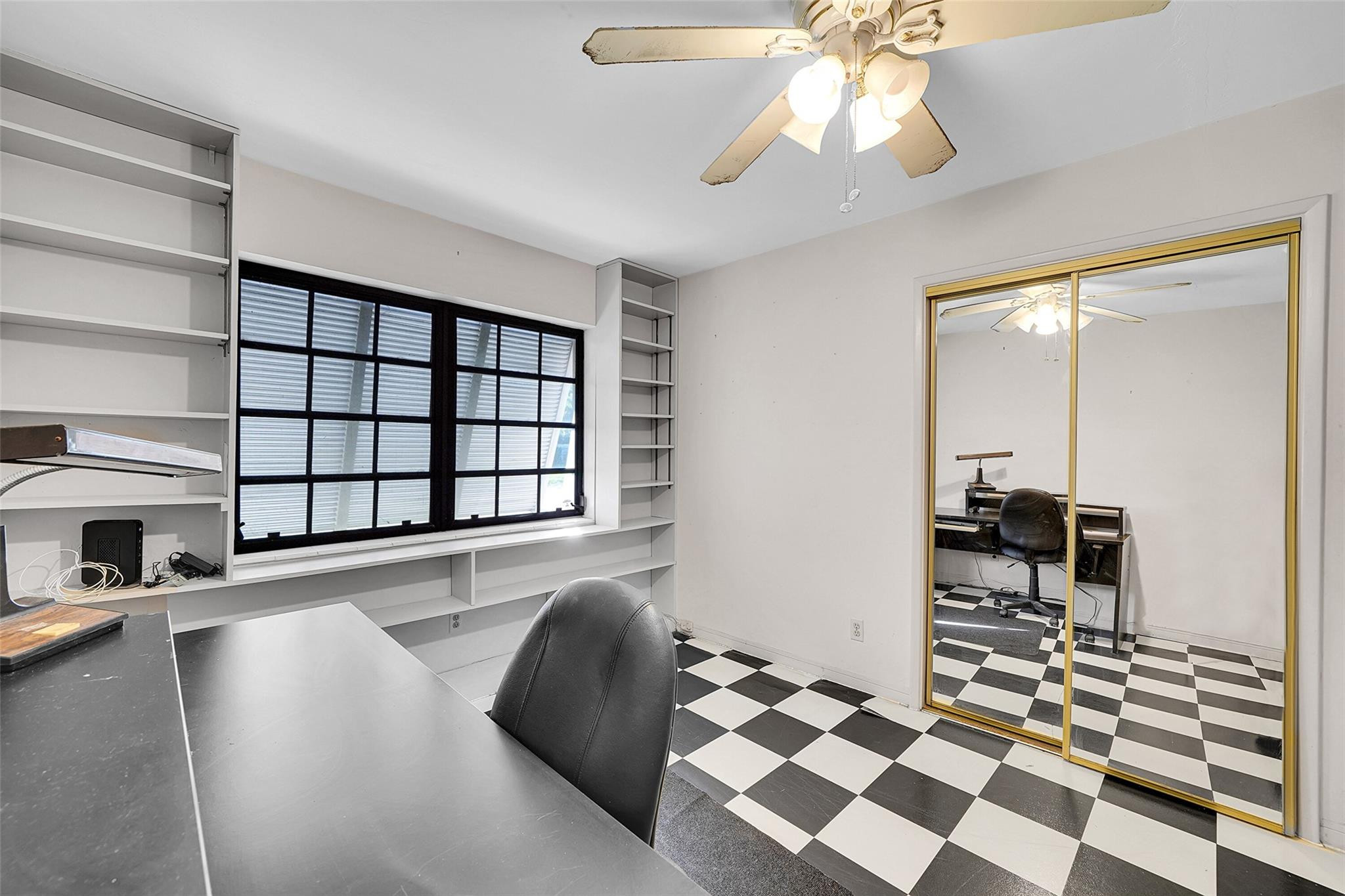 238 Southeast 3rd Street Dania Beach, FL 33004 - Photo 22 of 34 a living room with a large bed and a chandelier