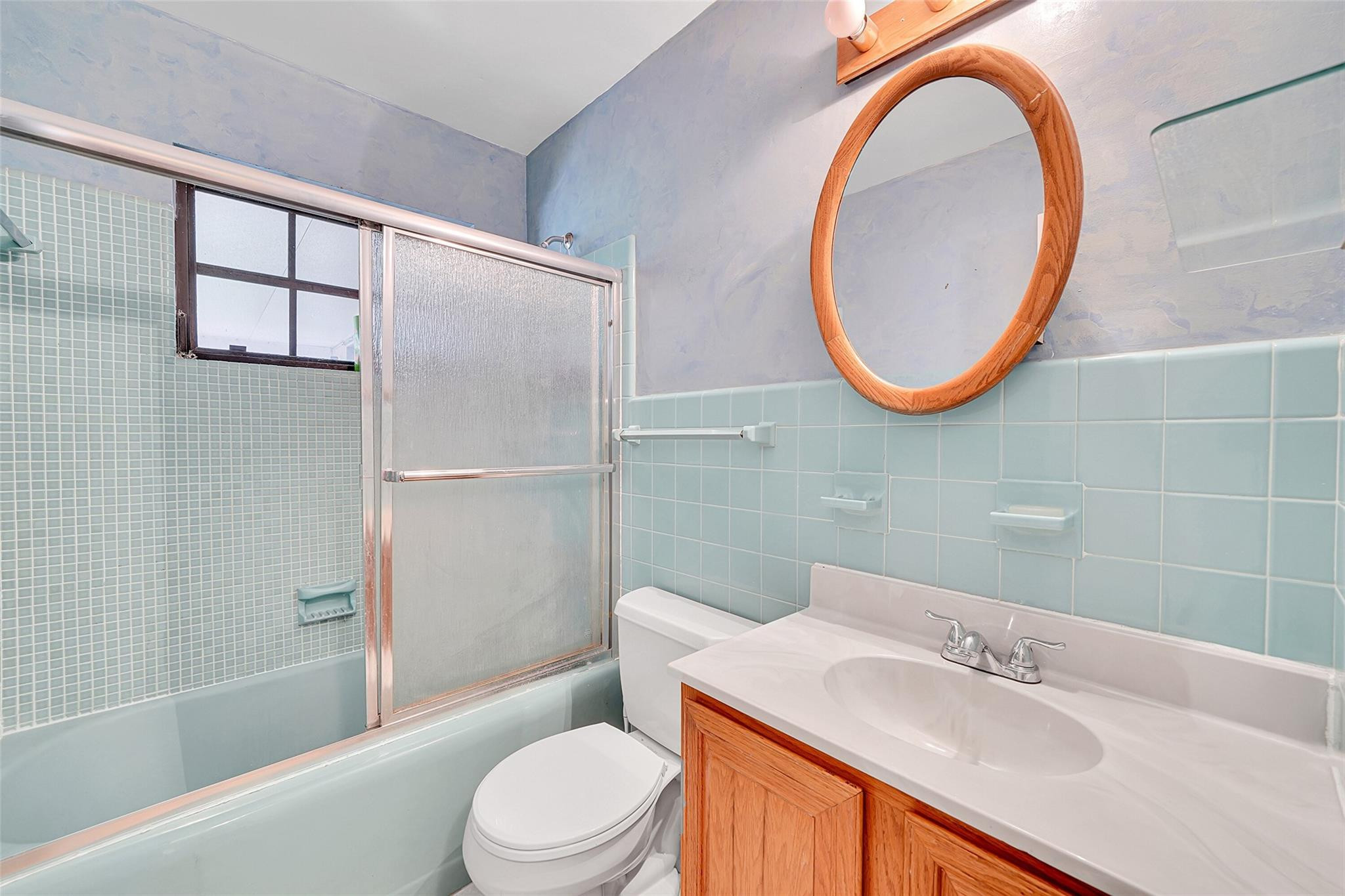 238 Southeast 3rd Street Dania Beach, FL 33004 - Photo 26 of 34 a bathroom with a sink a toilet and a mirror