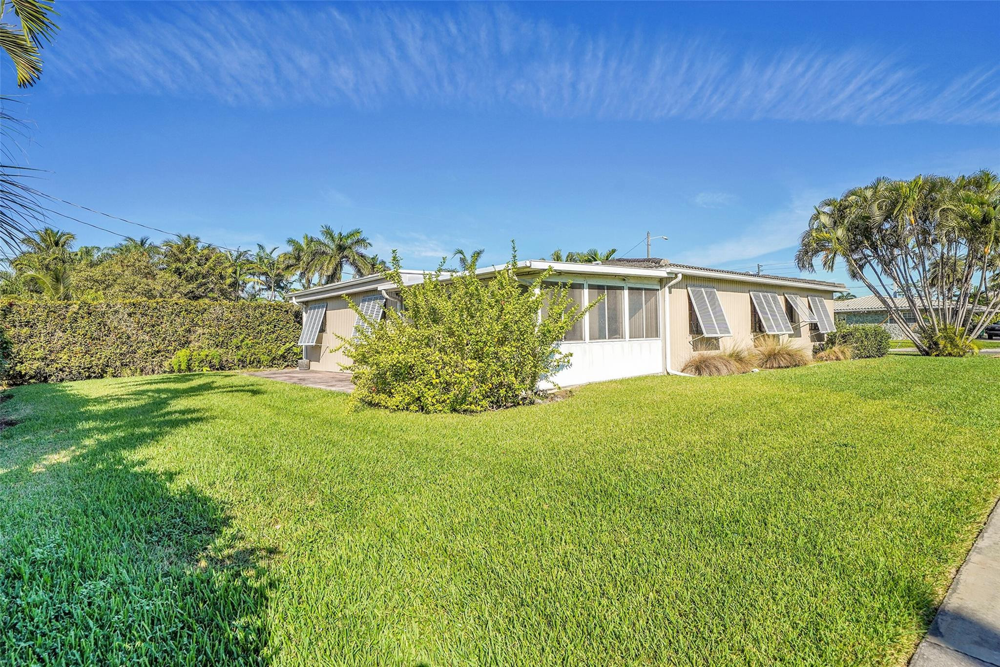 238 Southeast 3rd Street Dania Beach, FL 33004 - Photo 28 of 34 a view of an house with backyard space and garden