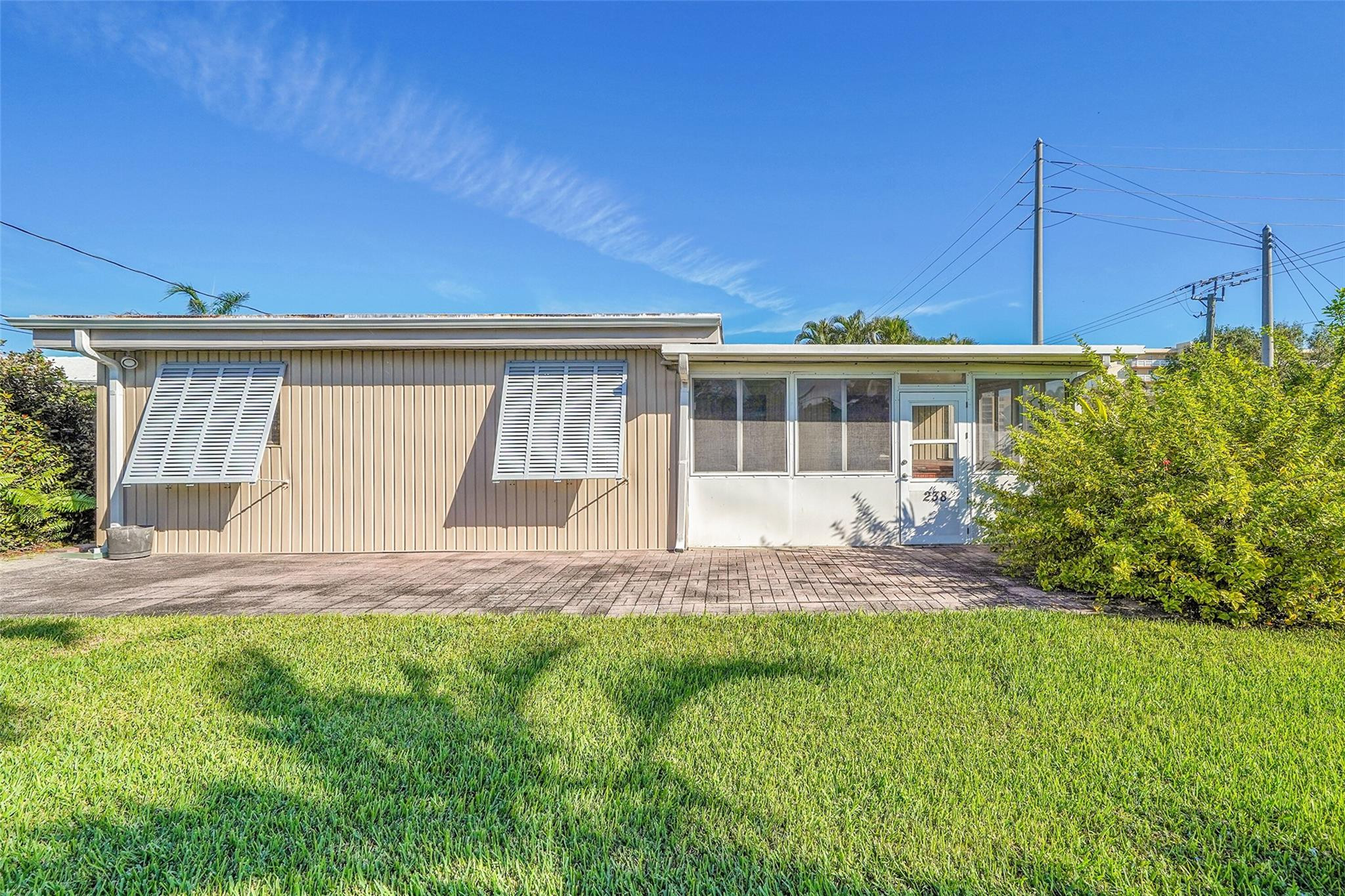 238 Southeast 3rd Street Dania Beach, FL 33004 - Photo 29 of 34 a view of a house with a big yard and plants