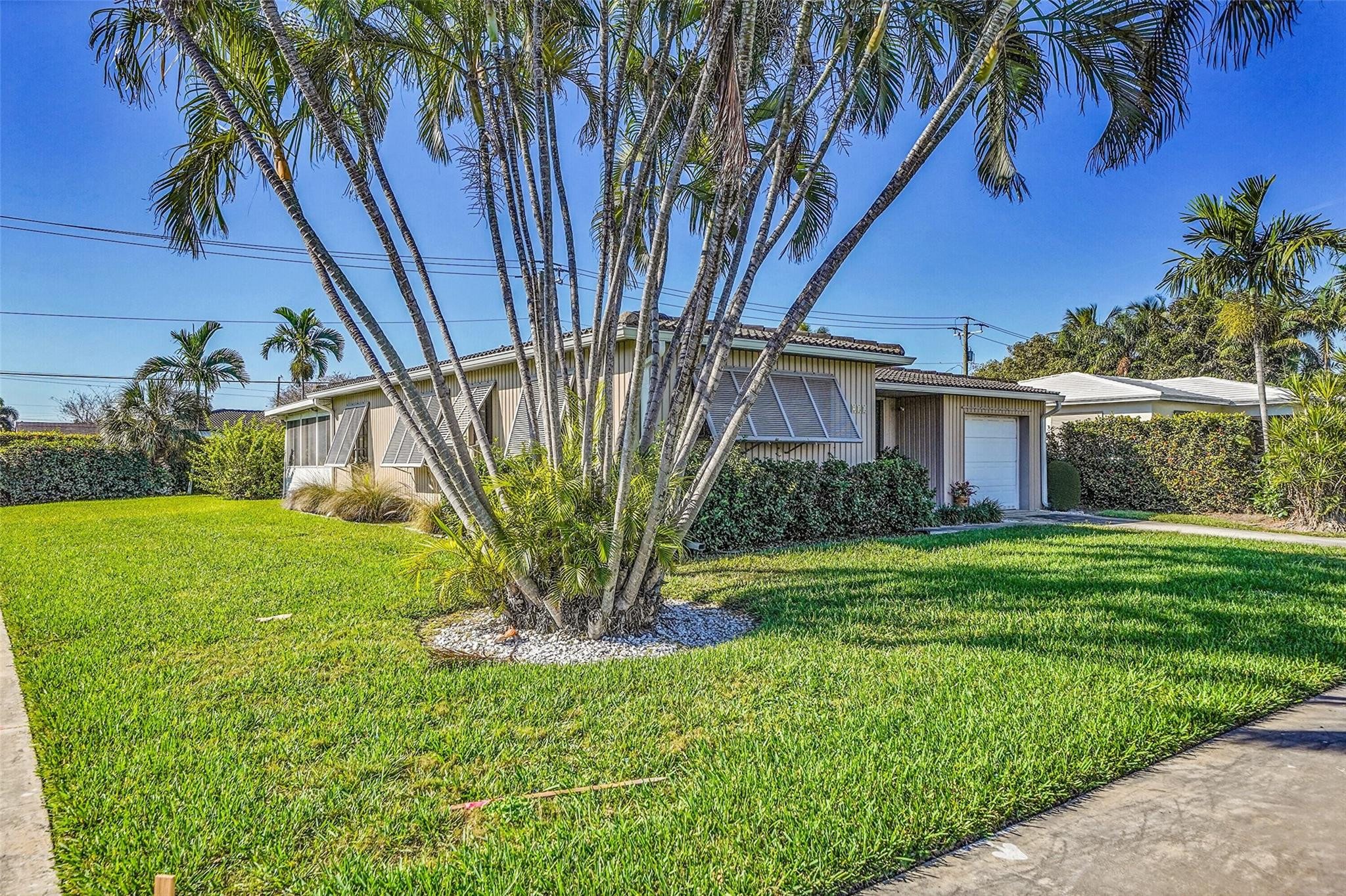 238 Southeast 3rd Street Dania Beach, FL 33004 - Photo 3 of 34 a house view with a garden space