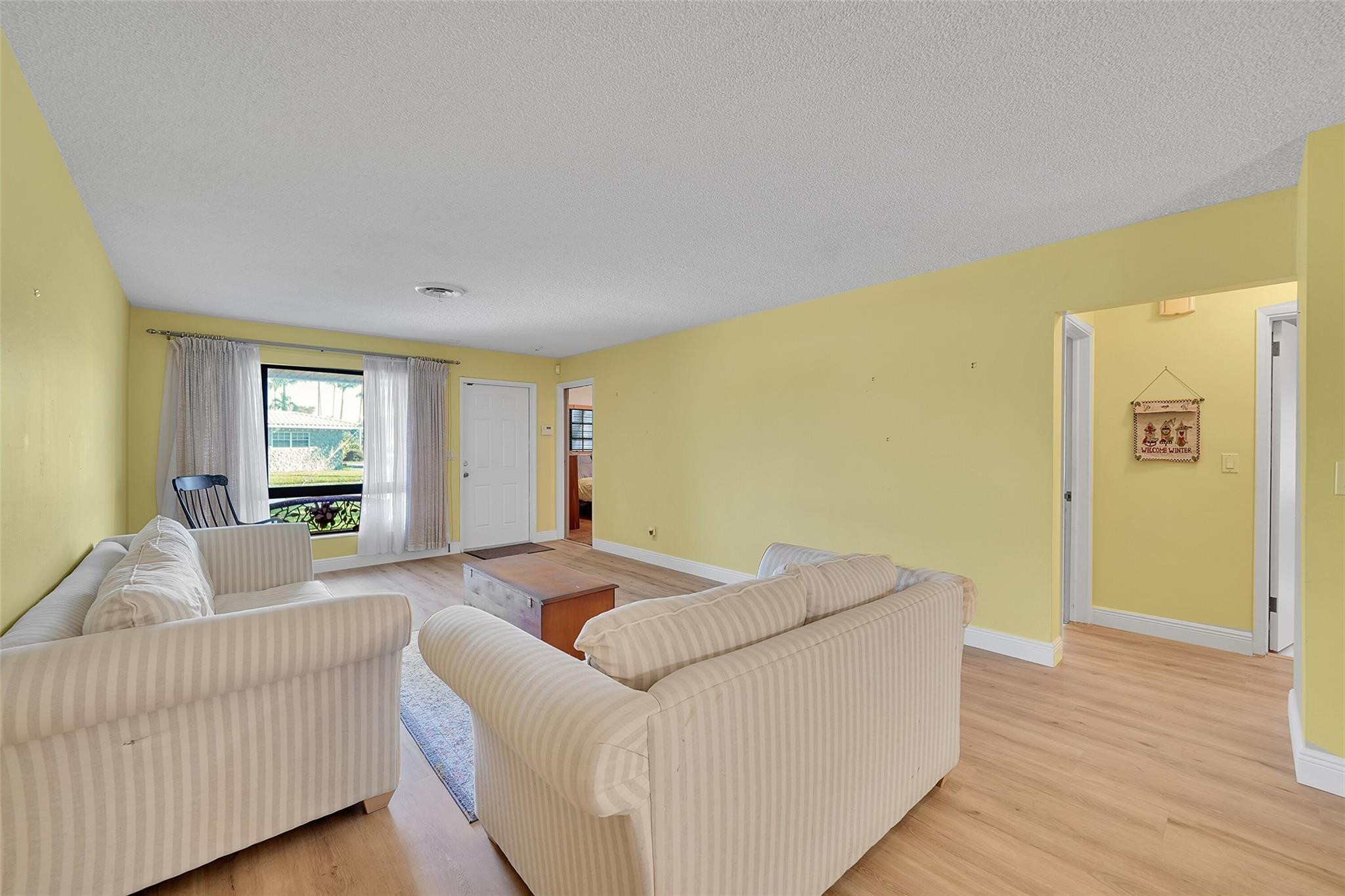 238 Southeast 3rd Street Dania Beach, FL 33004 - Photo 5 of 34 a living room with furniture and a window
