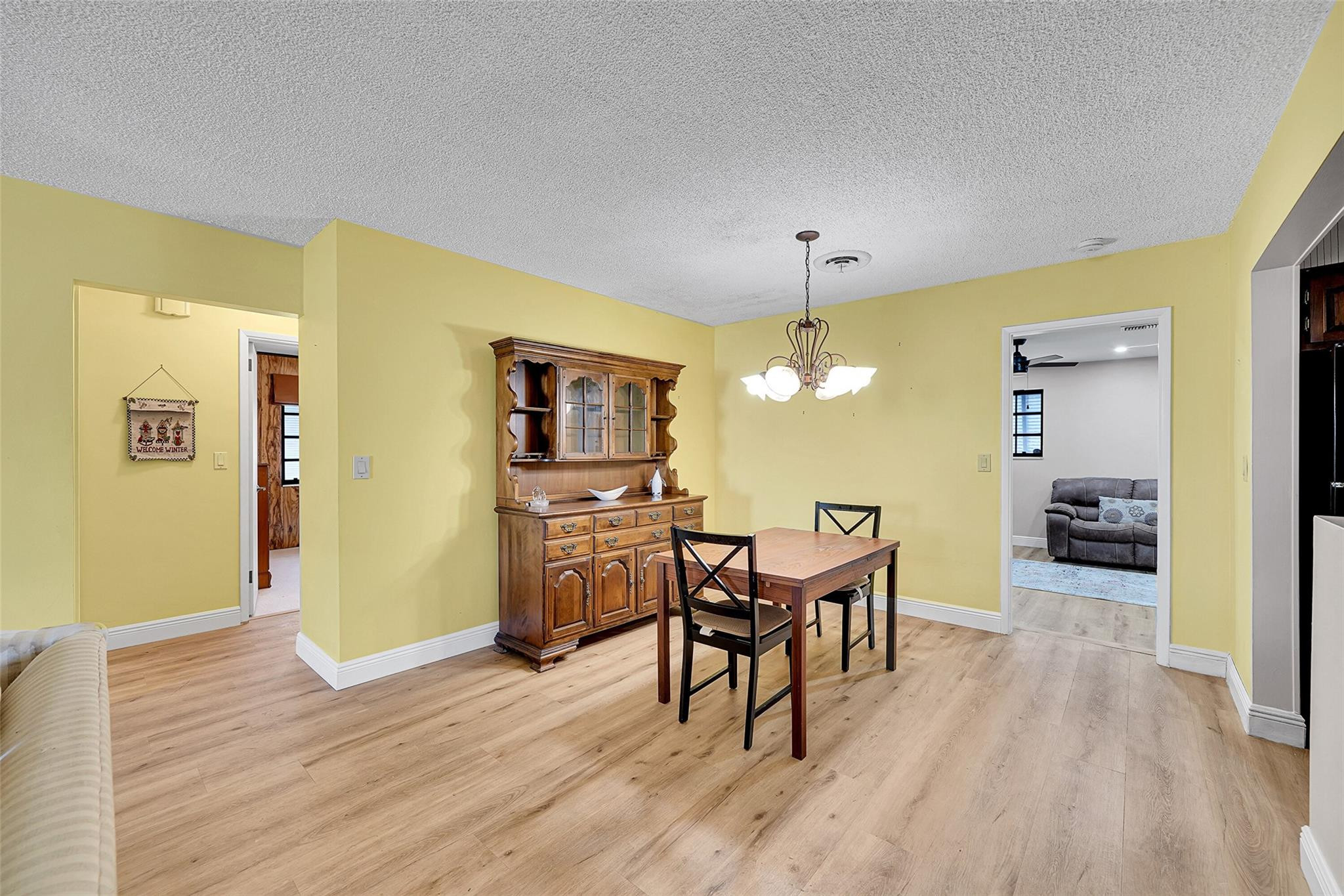 238 Southeast 3rd Street Dania Beach, FL 33004 - Photo 7 of 34 a view of a dining room with furniture and wooden floor