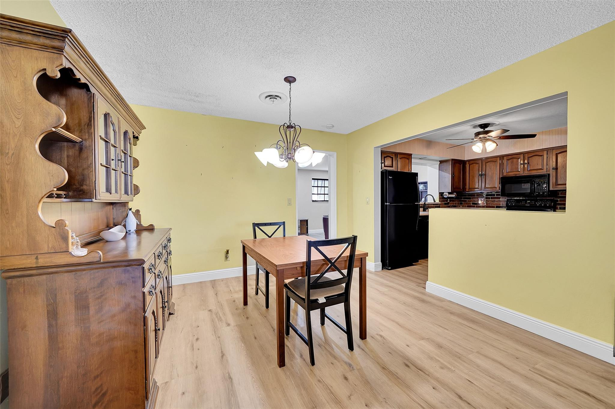 238 Southeast 3rd Street Dania Beach, FL 33004 - Photo 8 of 34 a view of a dining room with furniture and wooden floor