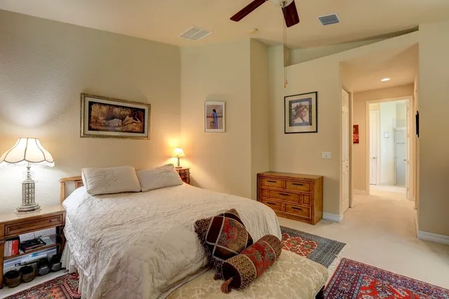 a bedroom with a bed and a dresser