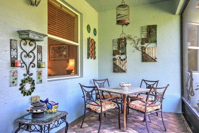 a dining room with furniture and wooden floor