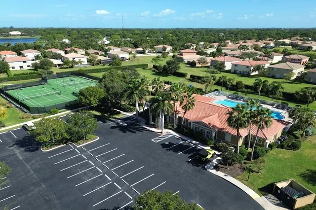 an aerial view of multiple houses with yard