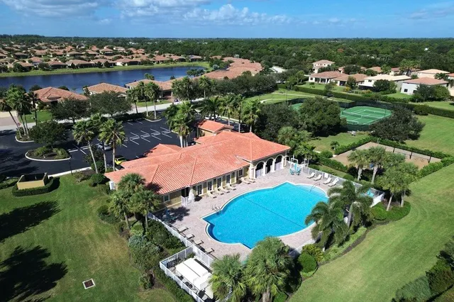an aerial view of residential houses and outdoor space